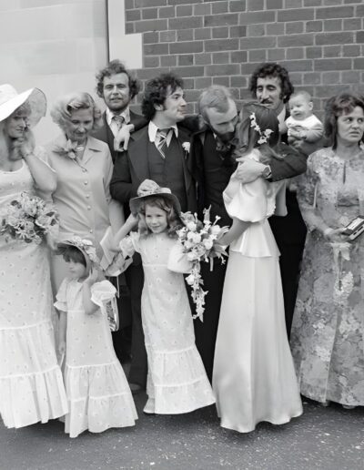Wedding party poses outside the church